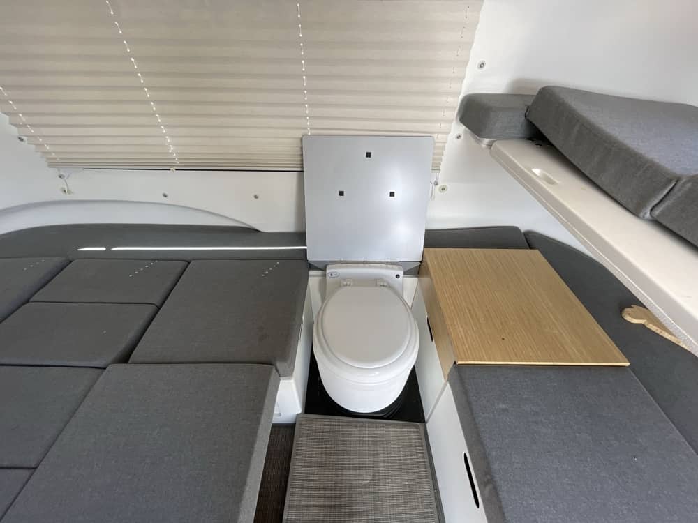 Interior — portable toilet with modular cushions arranged around it